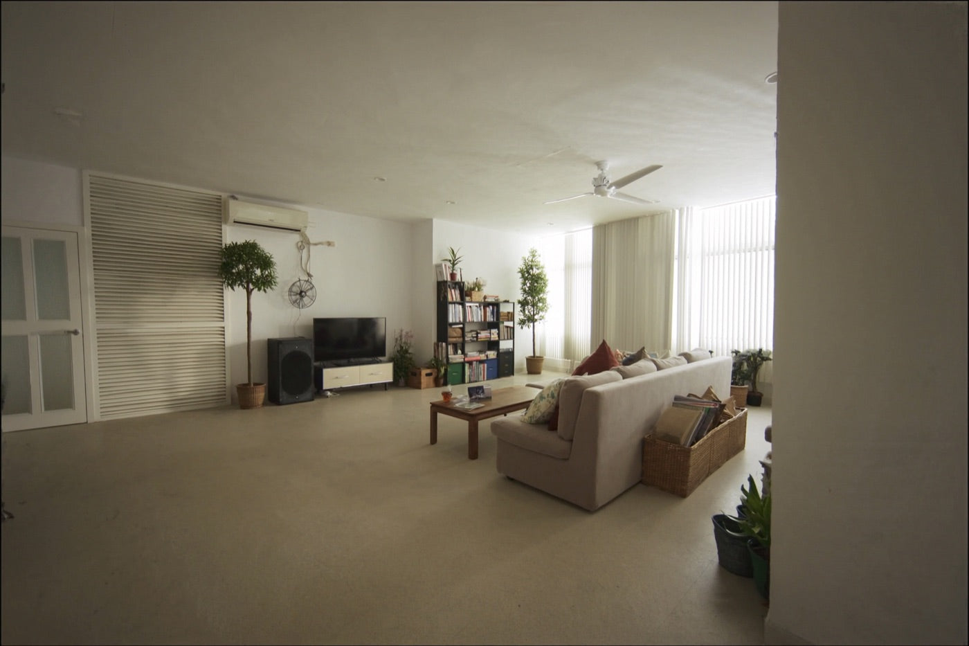 Empty living room in daylight with every light and fan switched off